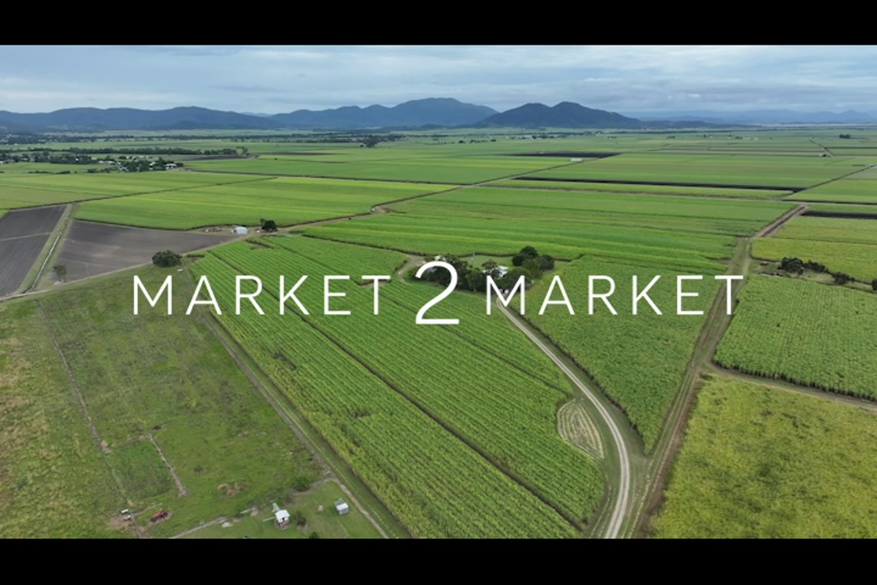 Aerial footage over rural, agricultural field in Mackay