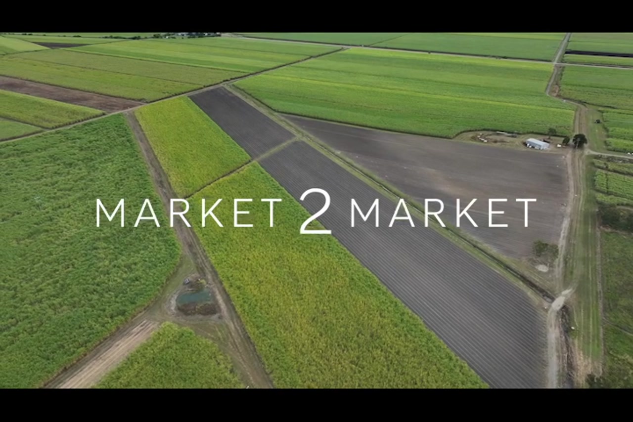 Aerial footage over rural, agricultural field in Mackay
