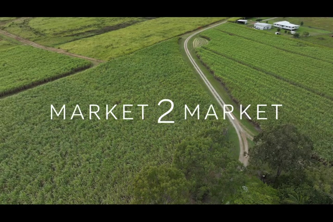 Aerial footage over rural, agricultural field in Mackay