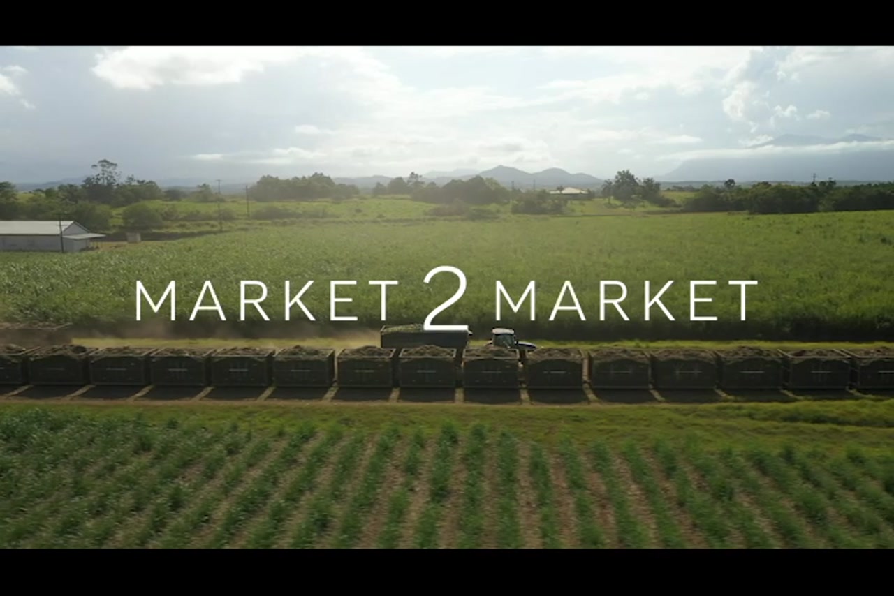 Aerial footage tracking along with a tractor in agricultural field in Far North Queensland