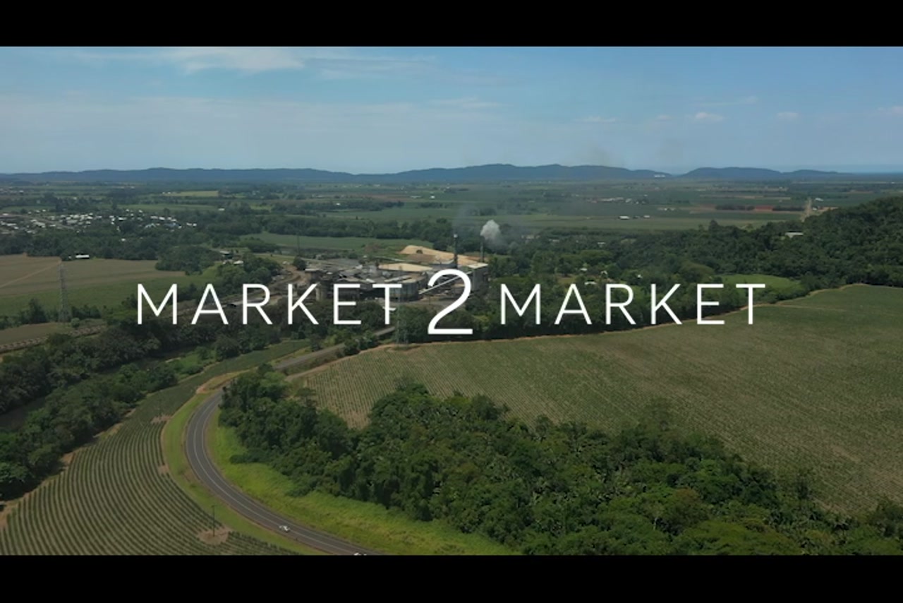 Aerial footage of agricultural fields and South Johnstone Sugar Mill, North Queensland