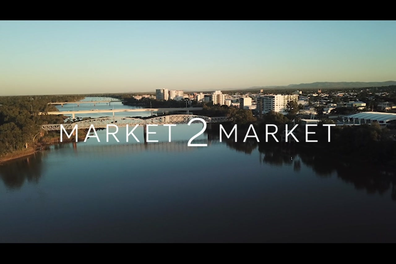 Aerial footage of bridges over Fitzroy River and Rockhampton CBD