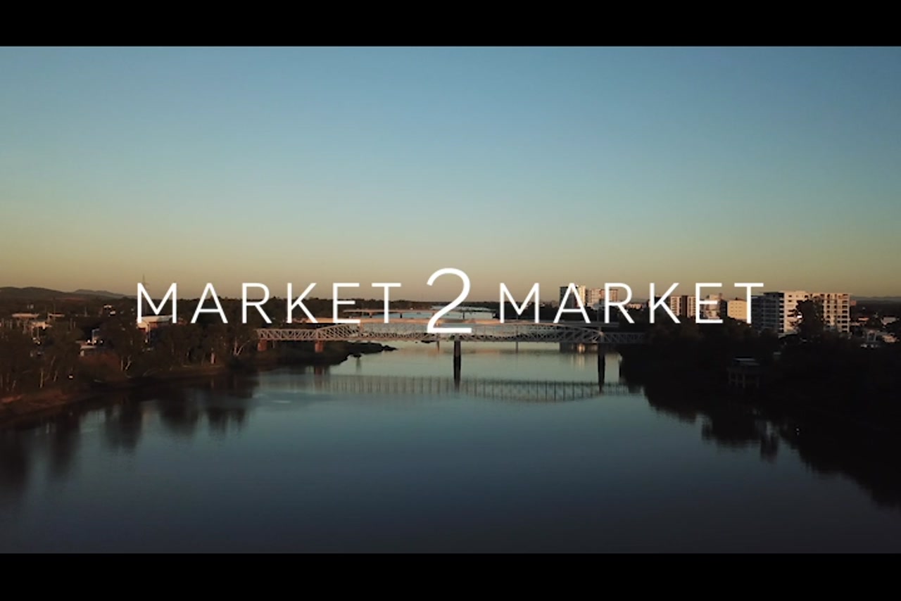 Aerial footage of bridges over Fitzroy River and Rockhampton CBD