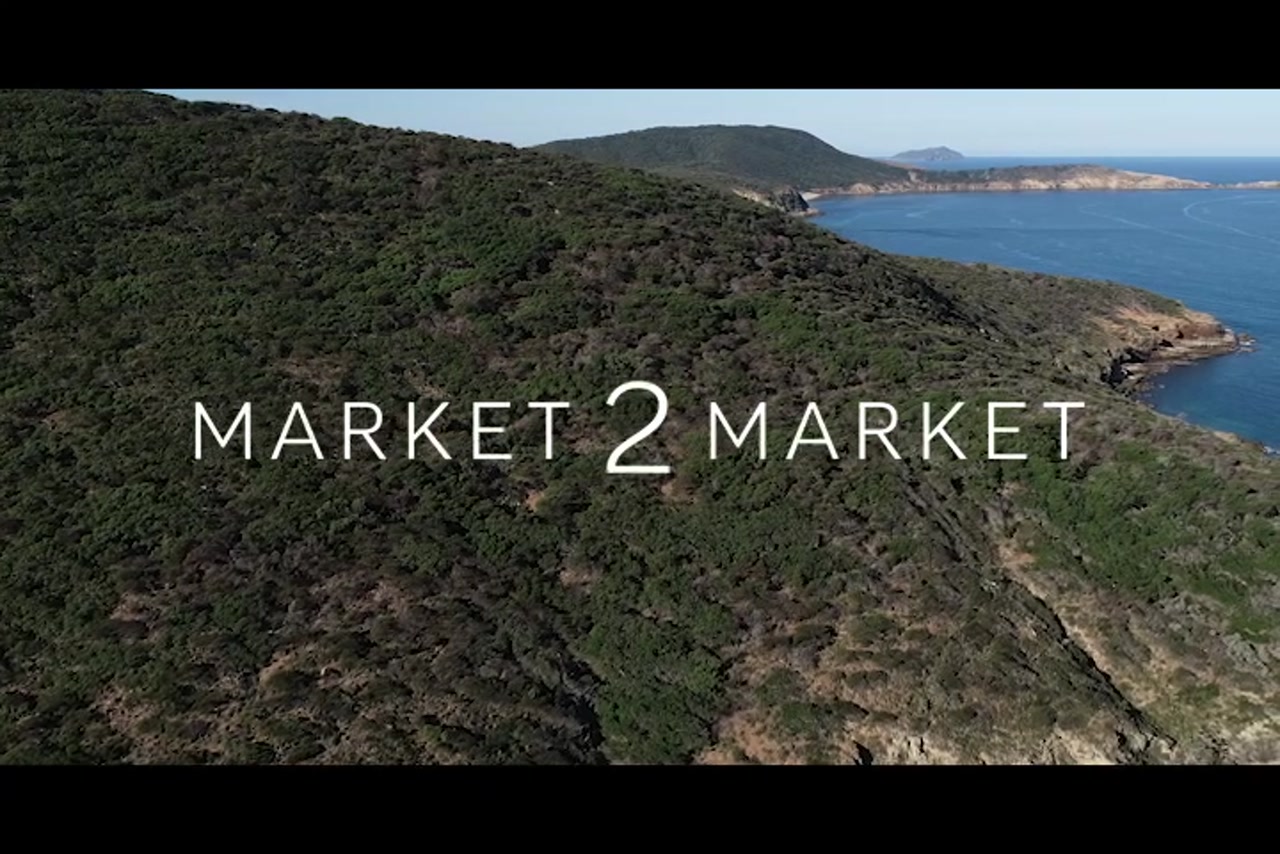 Aerial footage over rocky coastline of Great Keppel Island