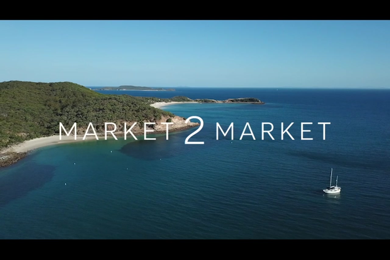 Aerial footage over Great Keppel Island with a Yacht in the ocean