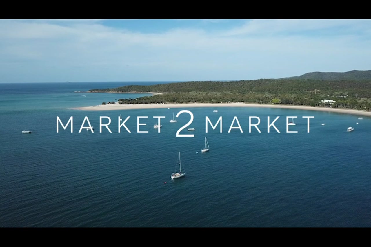 Aerial footage over Great Keppel Island with a Yacht in the ocean