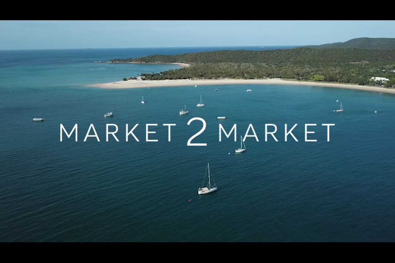 Aerial footage over Great Keppel Island with Yachts in the ocean