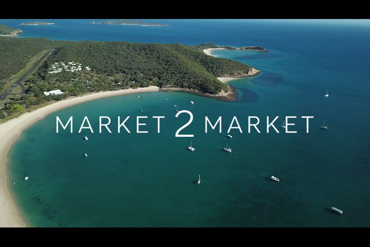 Aerial footage over Fisherman’s Beach with yachts in the ocean, Great Keppel Island