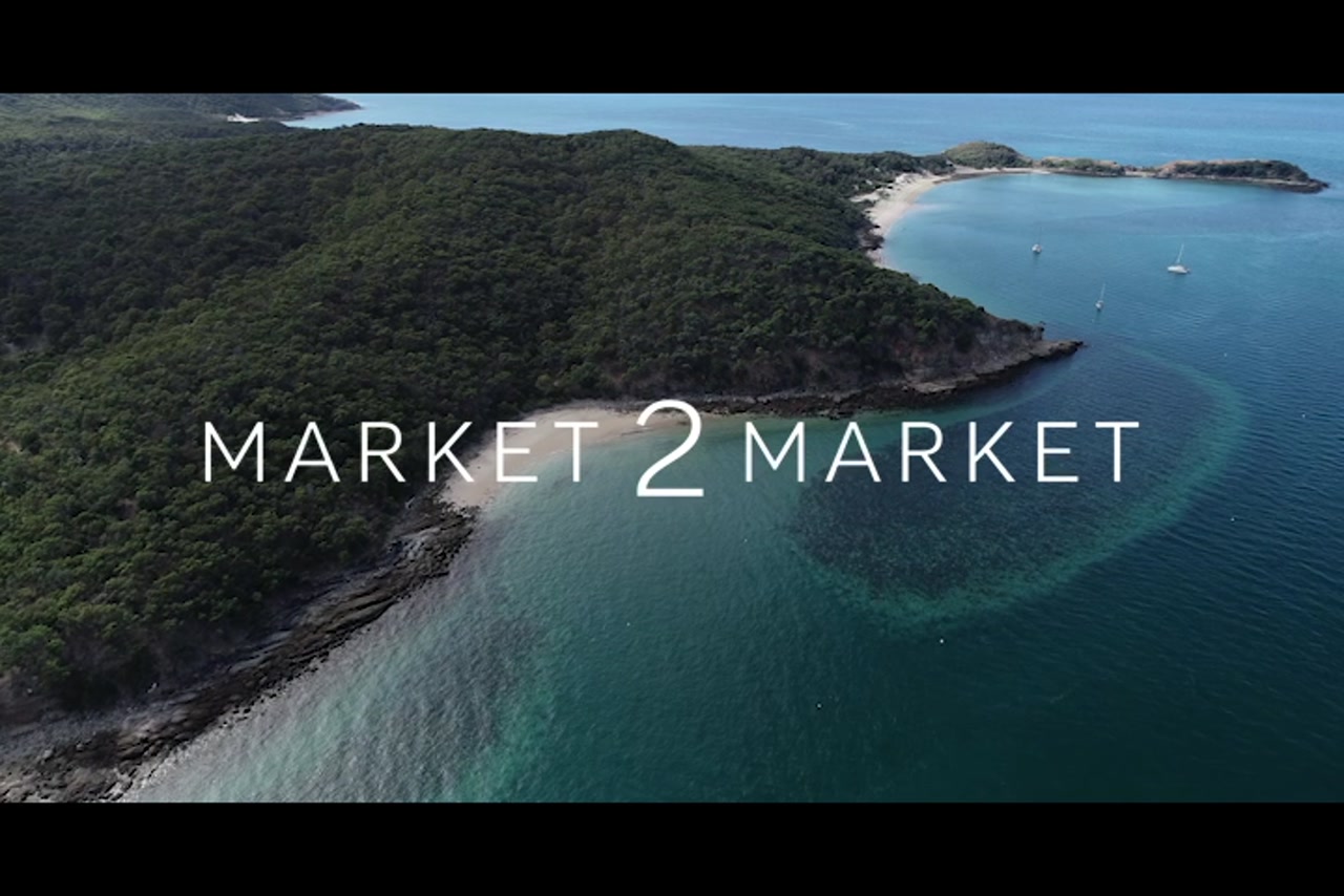 Aerial footage over reefs and small beachs on Great Keppel Island