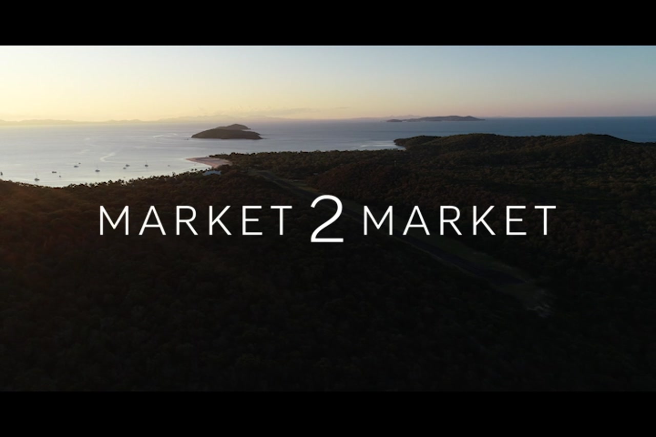 Aerial footage of coastline of Great Keppel Island at dusk