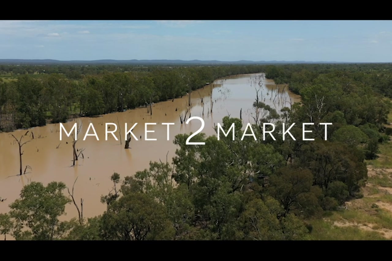 Aerial footage over river in semi-arid pastoral landscape