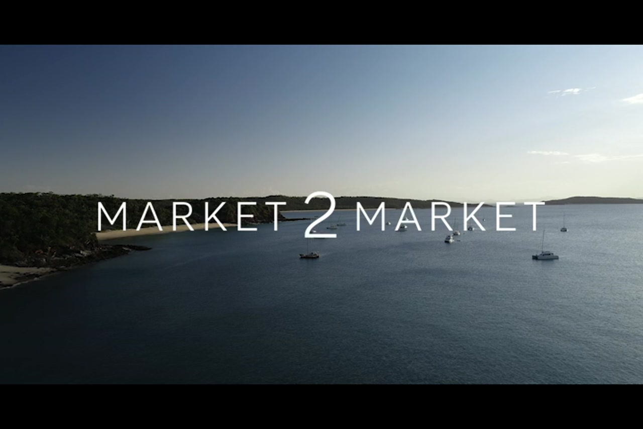 Aerial footage over coastline of Great Keppel Island at Dusk