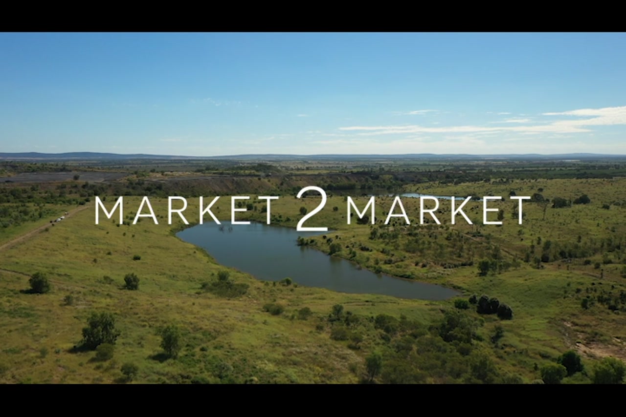 Aerial Footage over green countryside with small dam