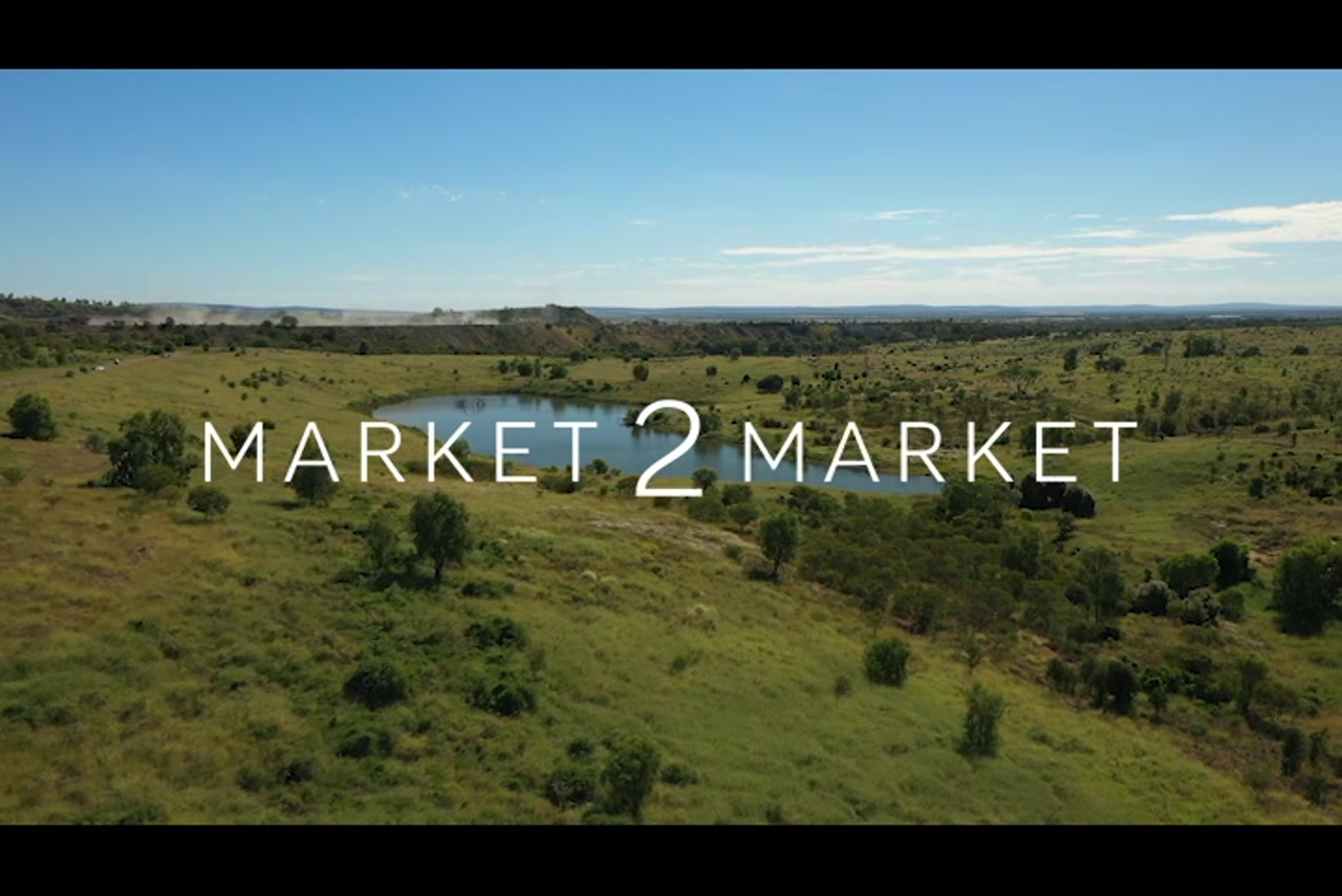 Aerial Footage over green countryside with small dam