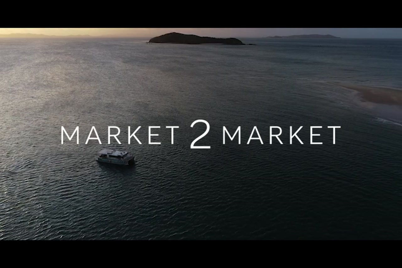 Aerial footage of ferry in ocean at dusk in the Keppel region