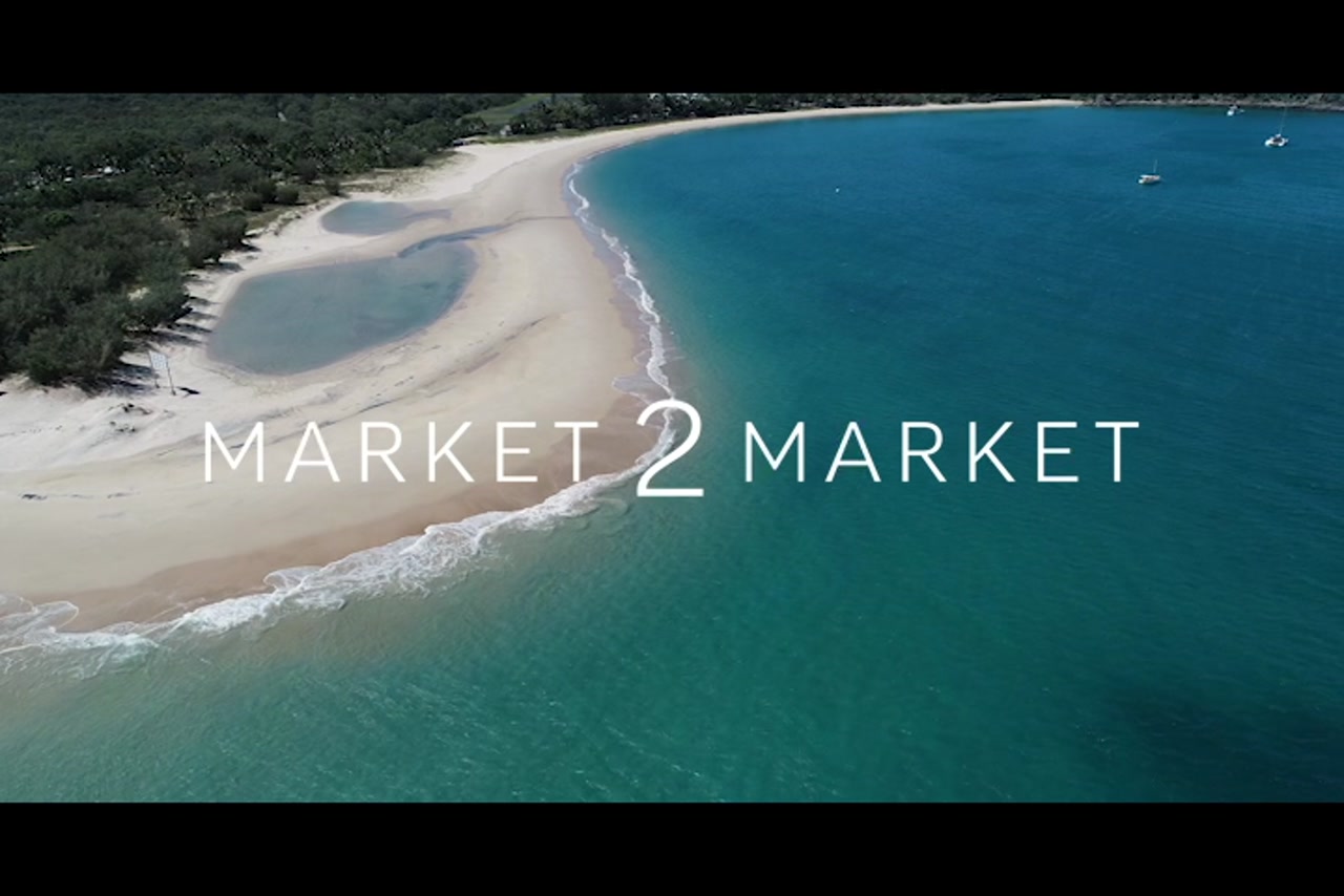 Aerial footage over beaches and coastline of Great Keppel Island