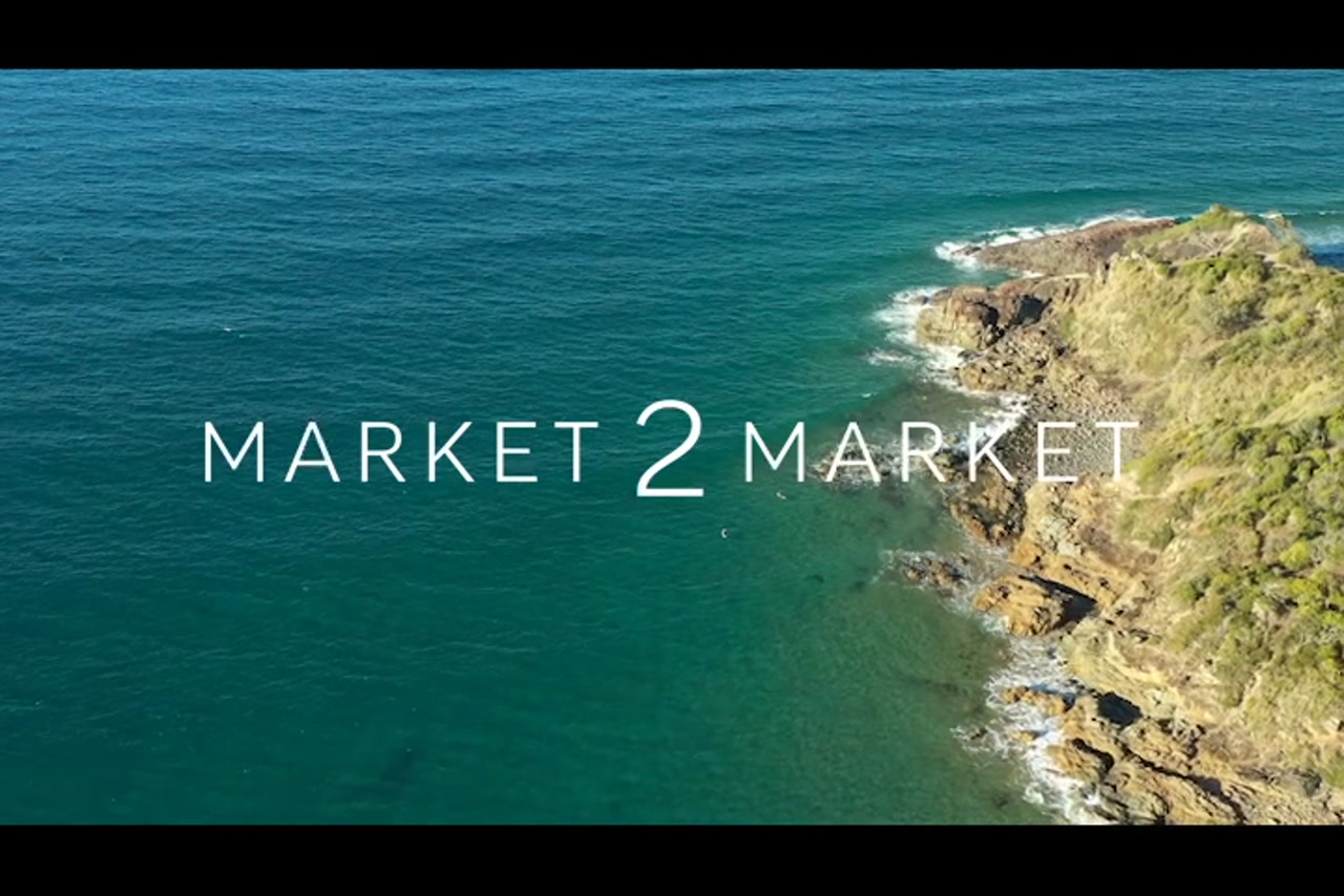 Aerial footage of a beach and rocky headland