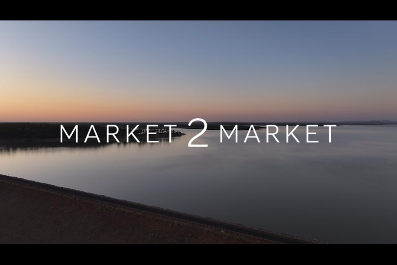 Aerial footage over a dam at dusk
