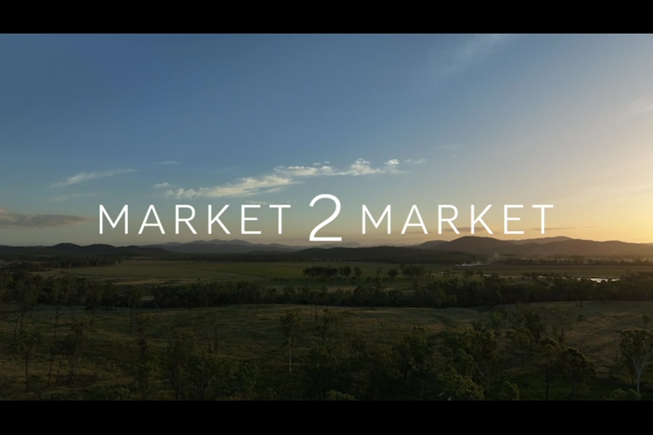 Aerial footage over wide pastoral landscape at dusk