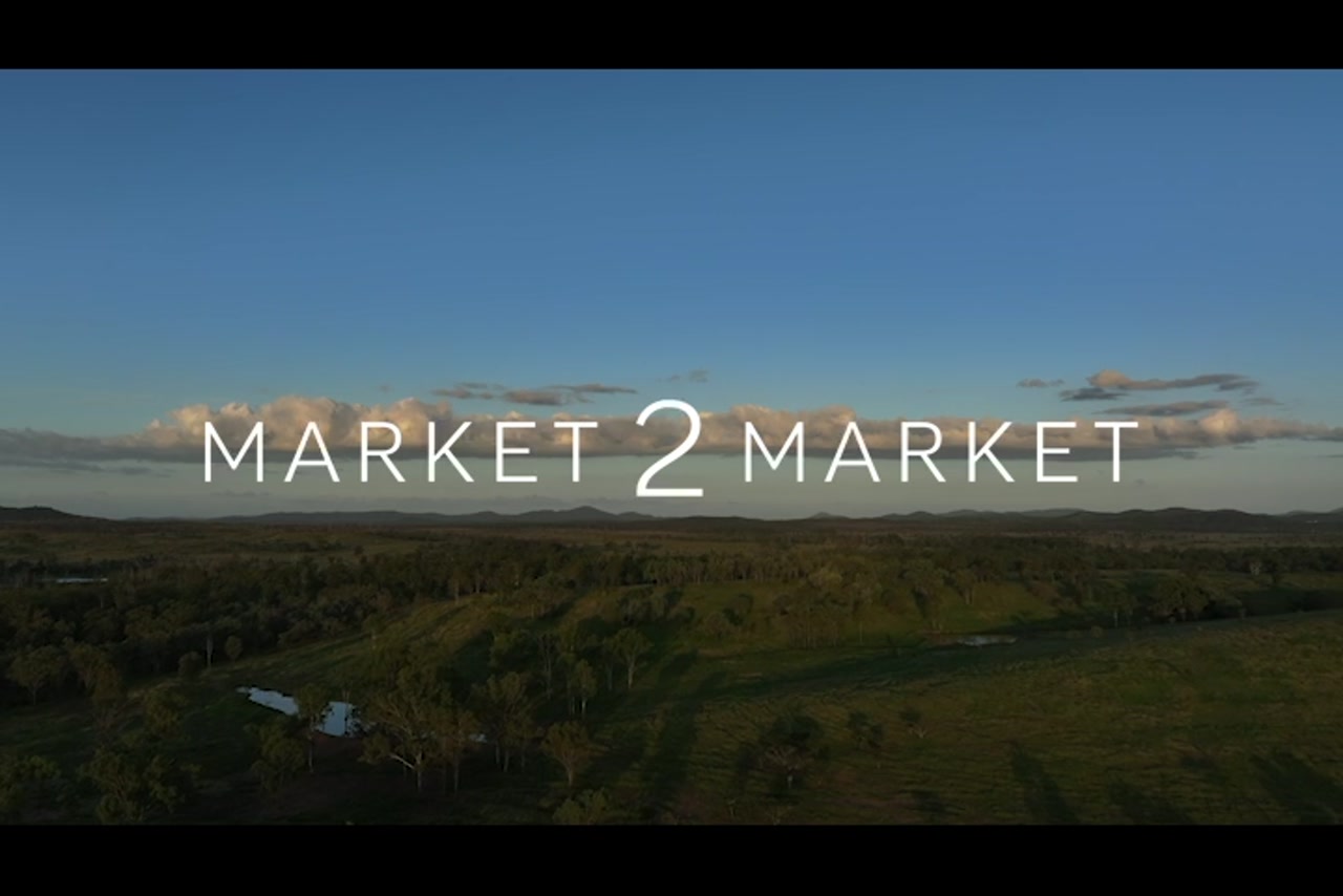 Aerial footage over wide pastoral landscape at dusk