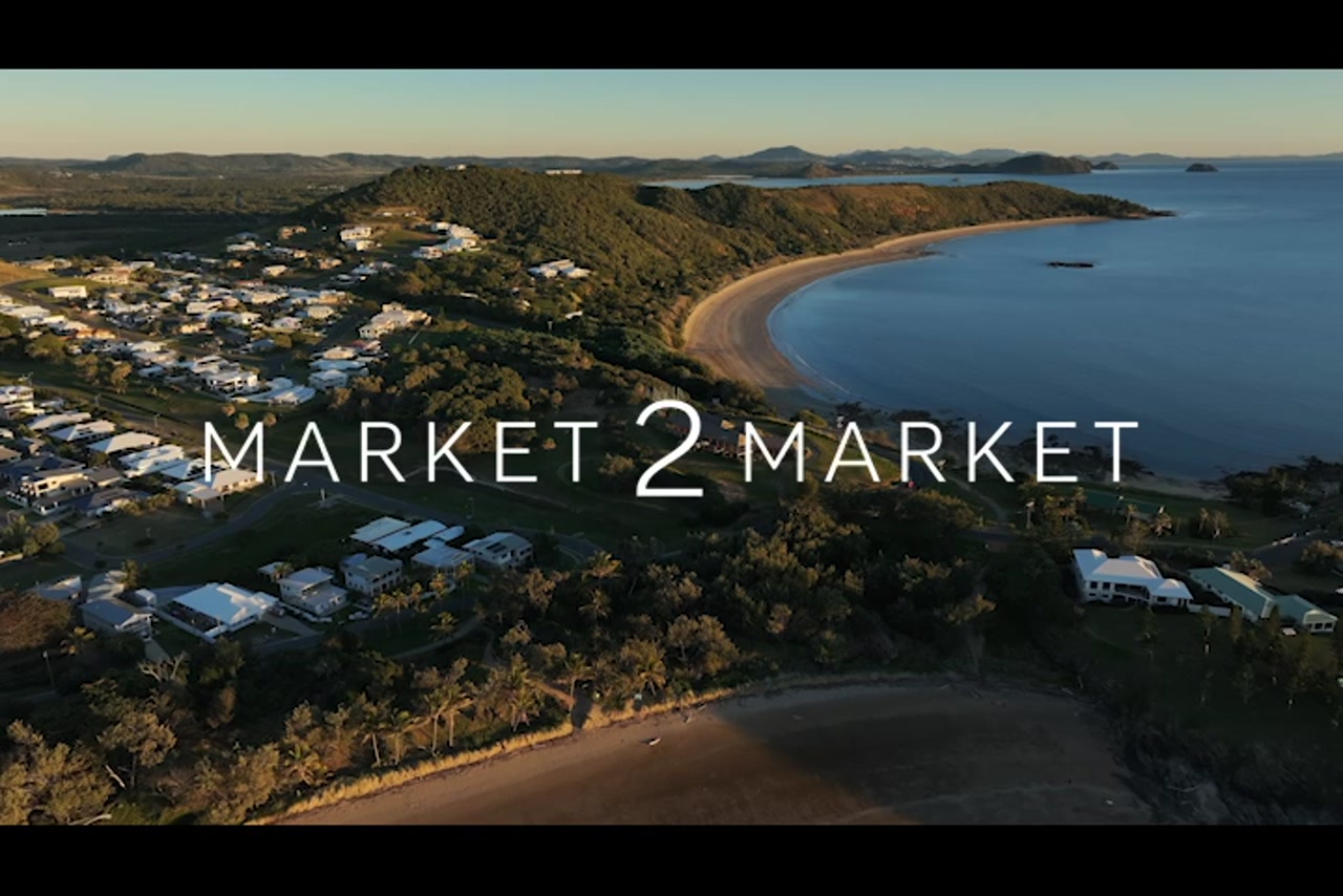 Aerial footage over beaches and coastline in the Emu Park area at dusk