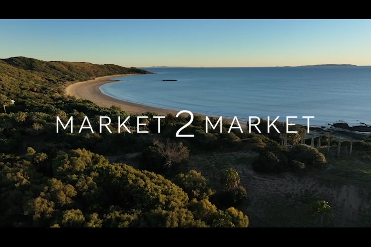 Aerial footage over beach in the Emu Park area  at dusk