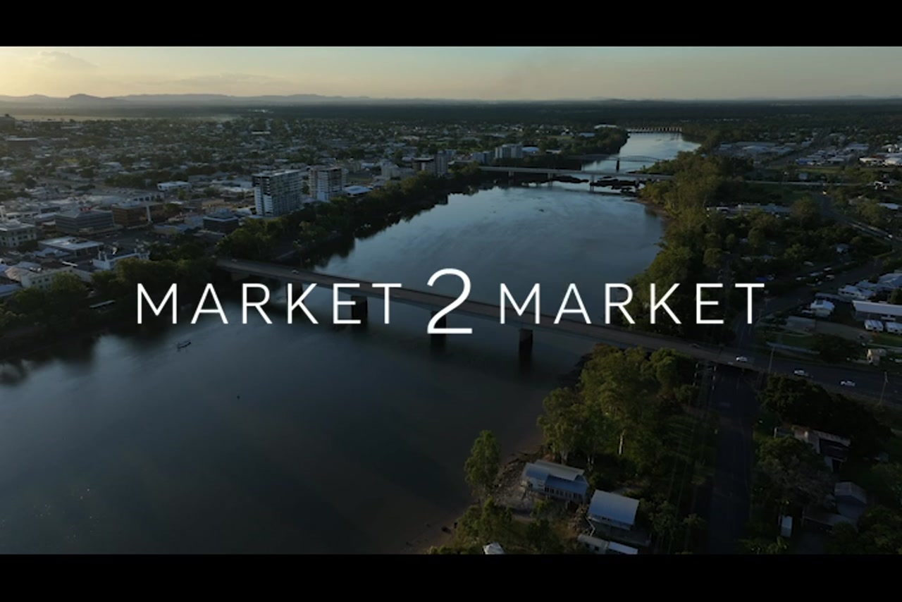 Aerial footage over Fitzroy River, Rockhampton CBD, at dusk