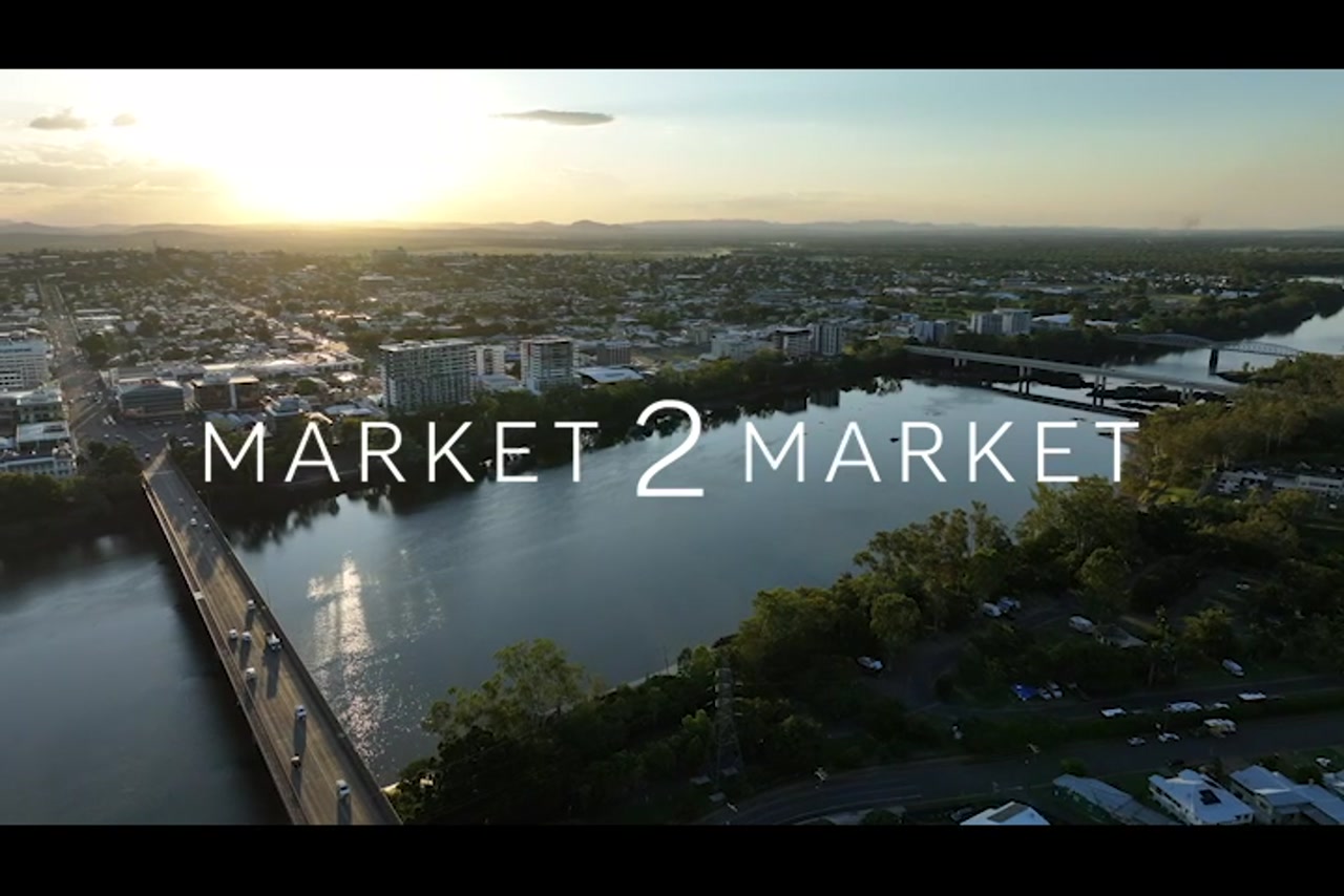 Aerial footage over Fitzroy River, Rockhampton CBD, at dusk