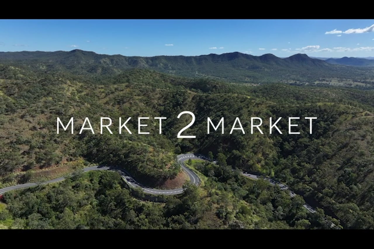 Aerial footage over winding road in countryside, Central Queensland