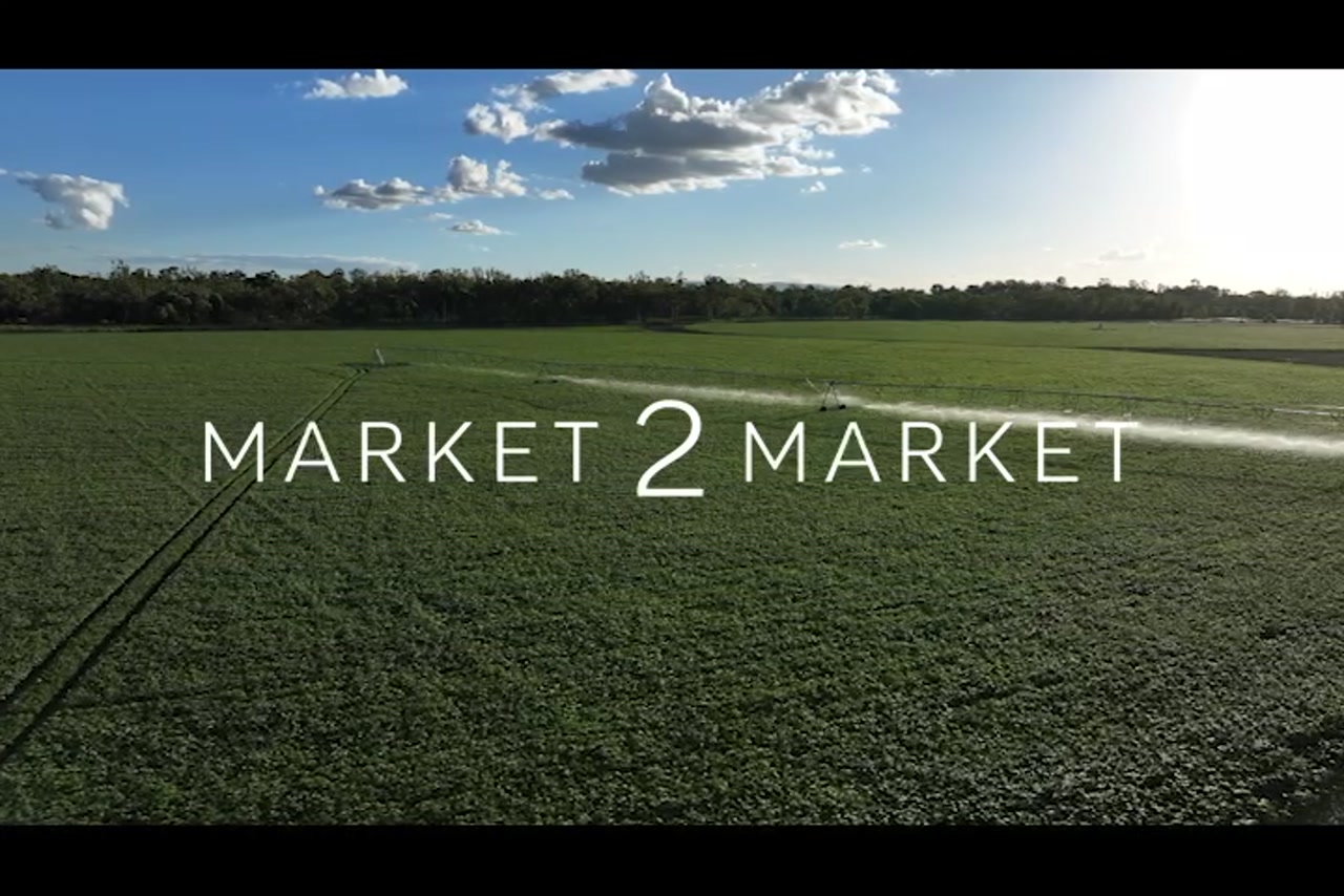 Aerial footage over lush green agricultural land