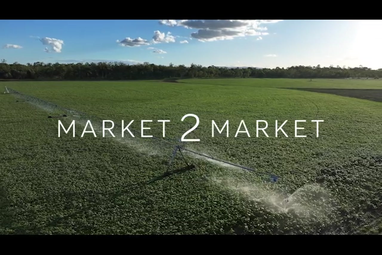 Aerial footage over lush green agricultural land