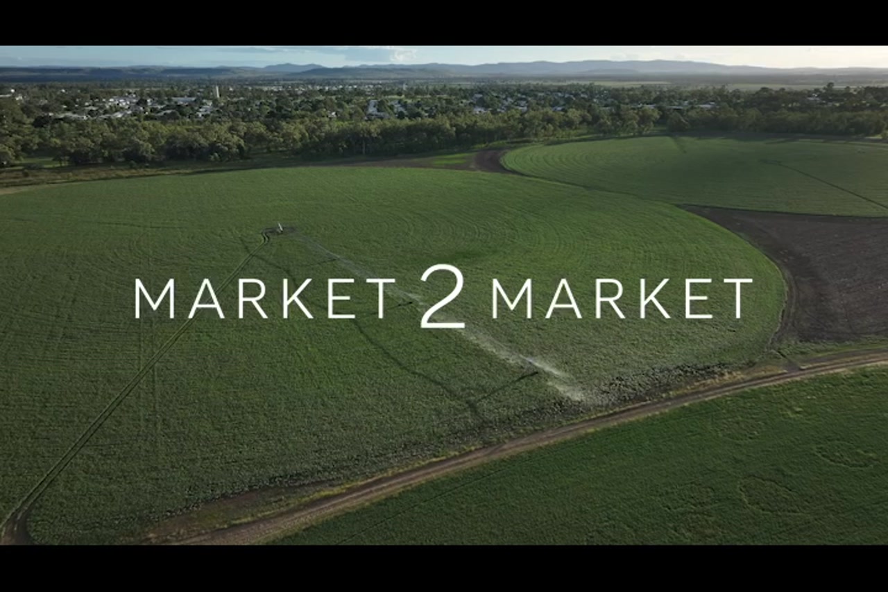 Aerial footage over lush green agricultural land