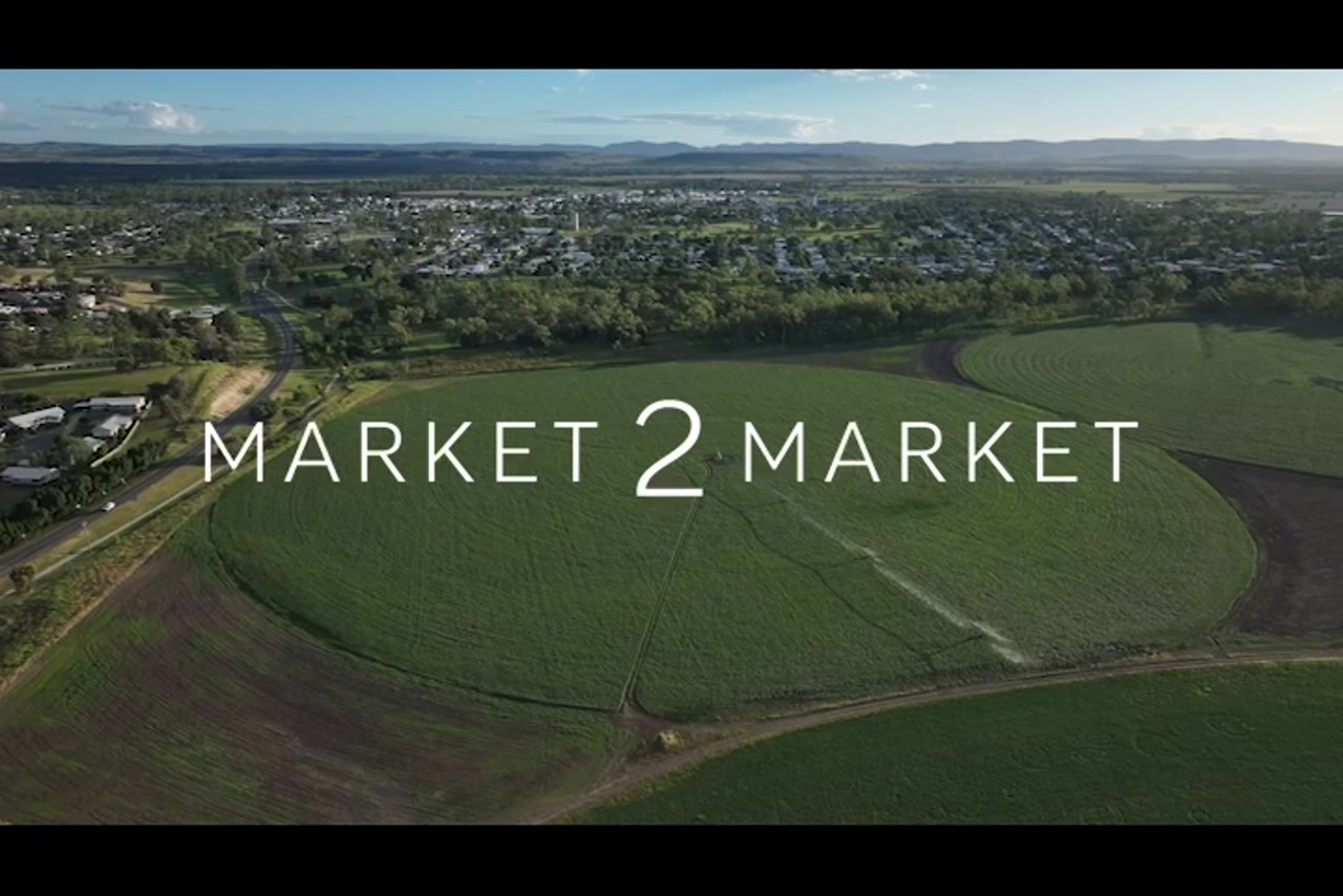 Aerial footage over lush green agricultural land