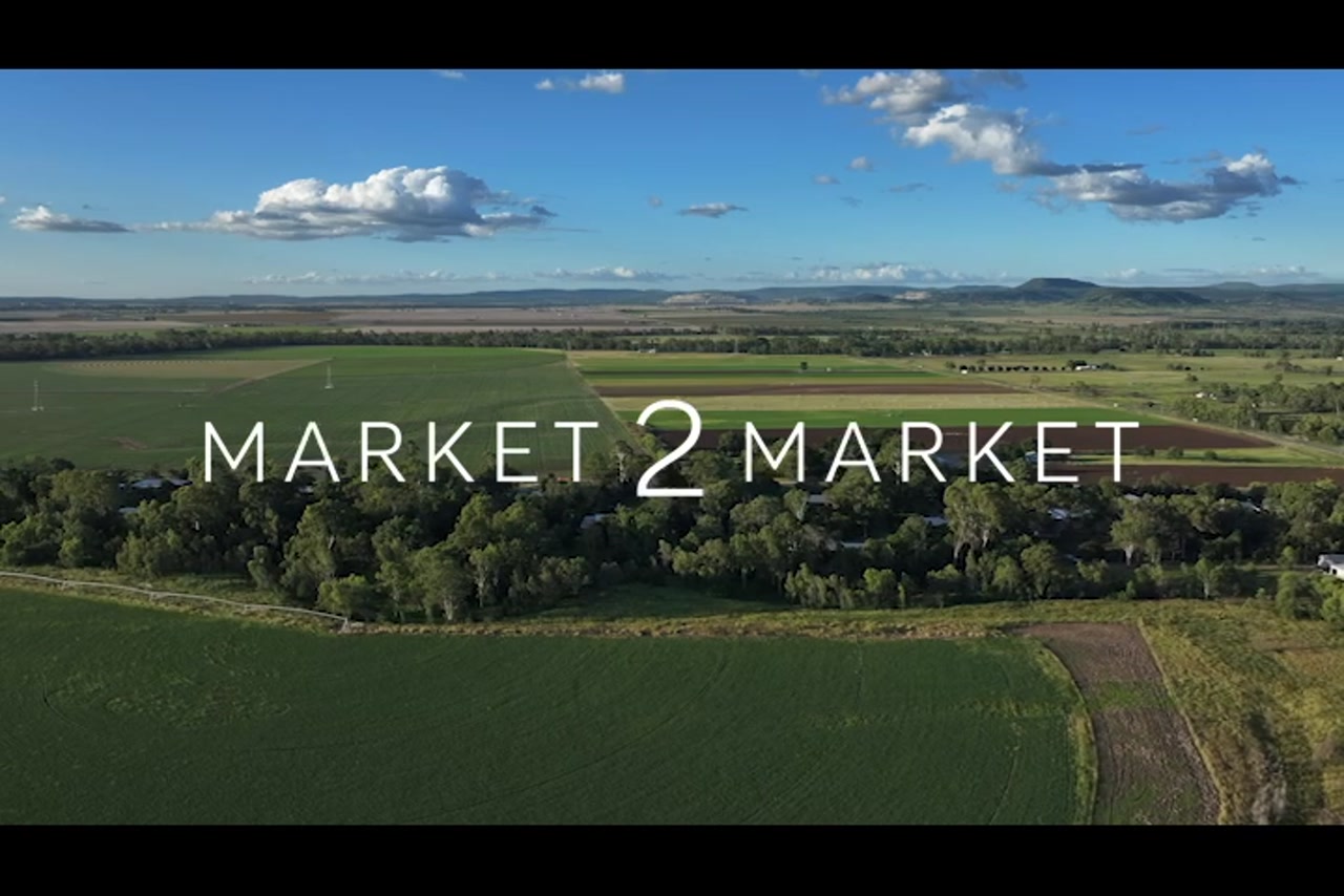 Aerial footage over lush green agricultural land