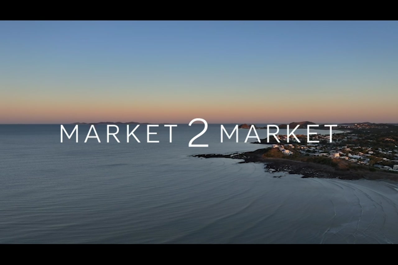 Aerial footage over Yeppoon coastline at dusk